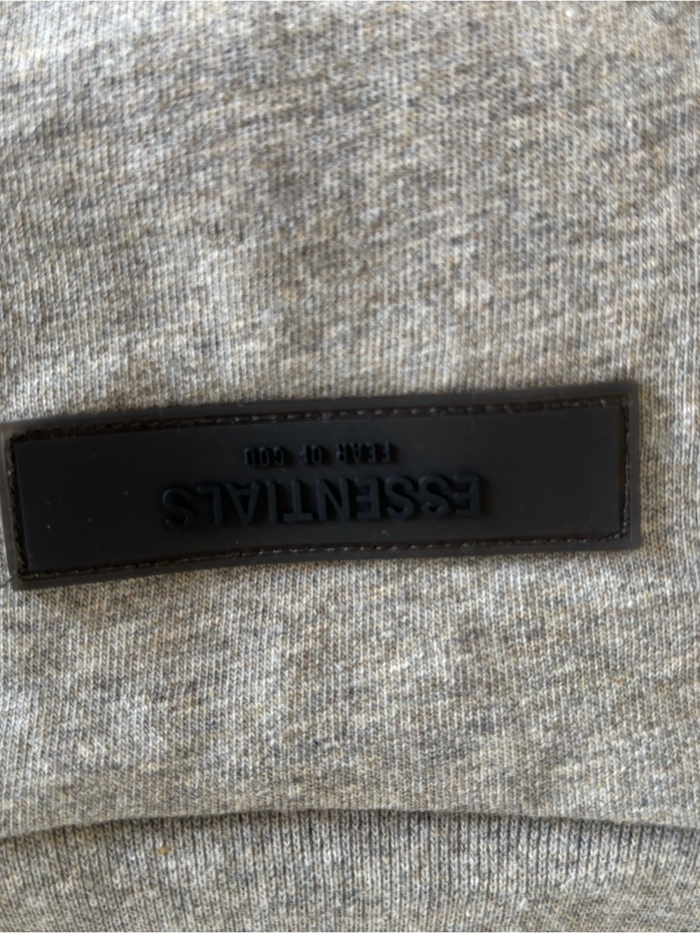ESSENTIALS Men’s Heather Grey Crewneck with Black Logo Patch